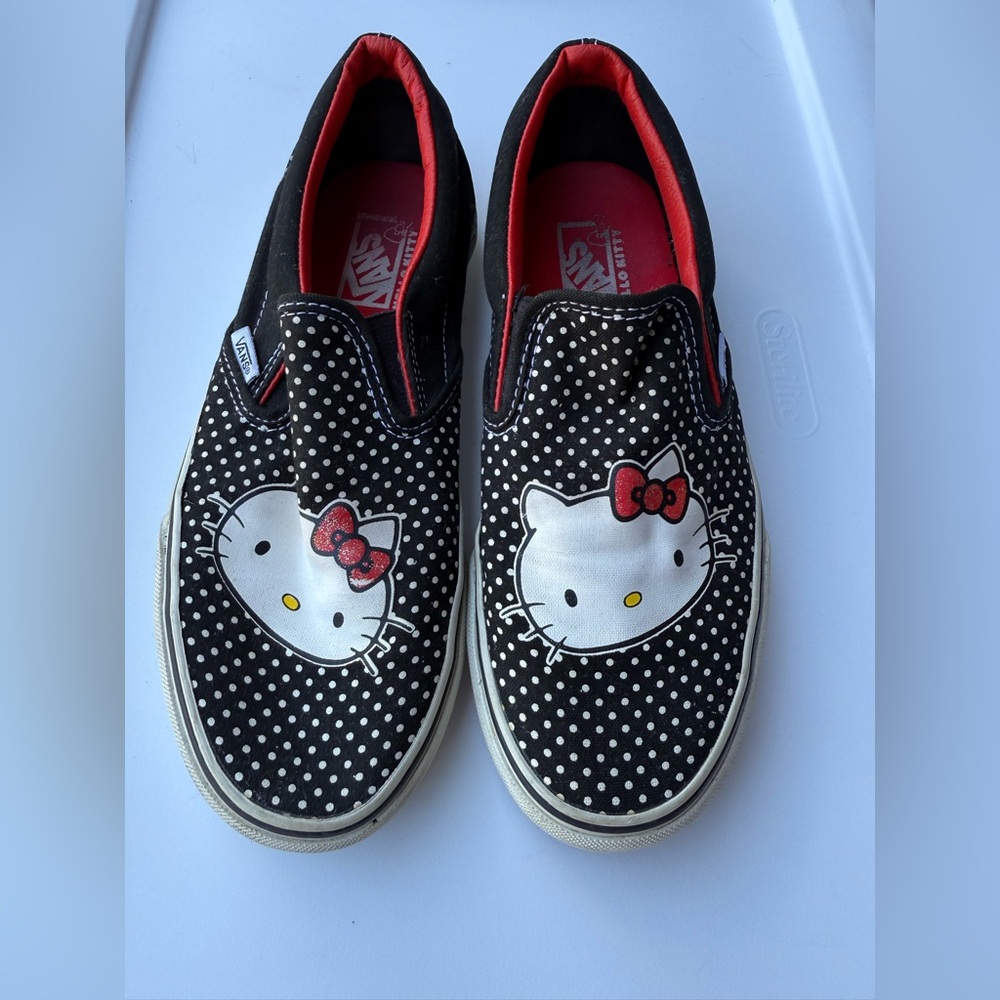 Vans Black and White Hello Kitty Slip-Ons.